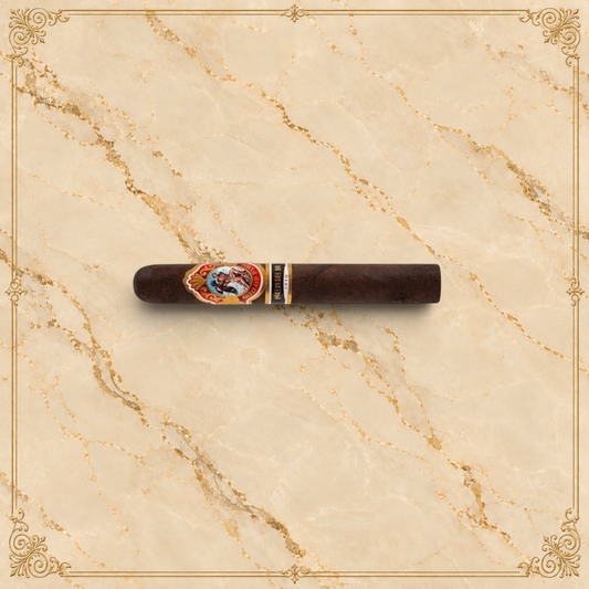 Arcadia Cigars God of Fire Serie B Gran Toro premium cigar with ornate band on a cream background
