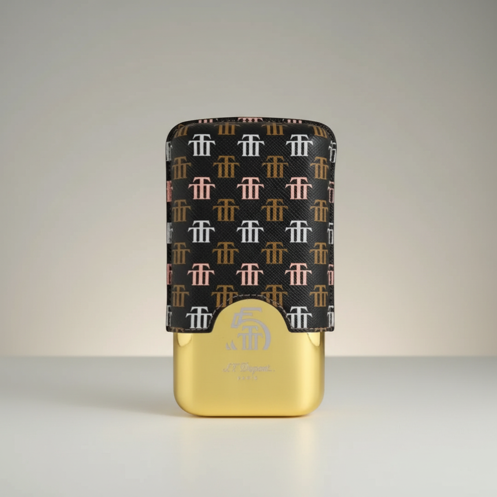 Arcadia Cigars S.T. Dupont Trinidad leather cigar case with repeating logo pattern and gold base, holds 2-3 cigars.