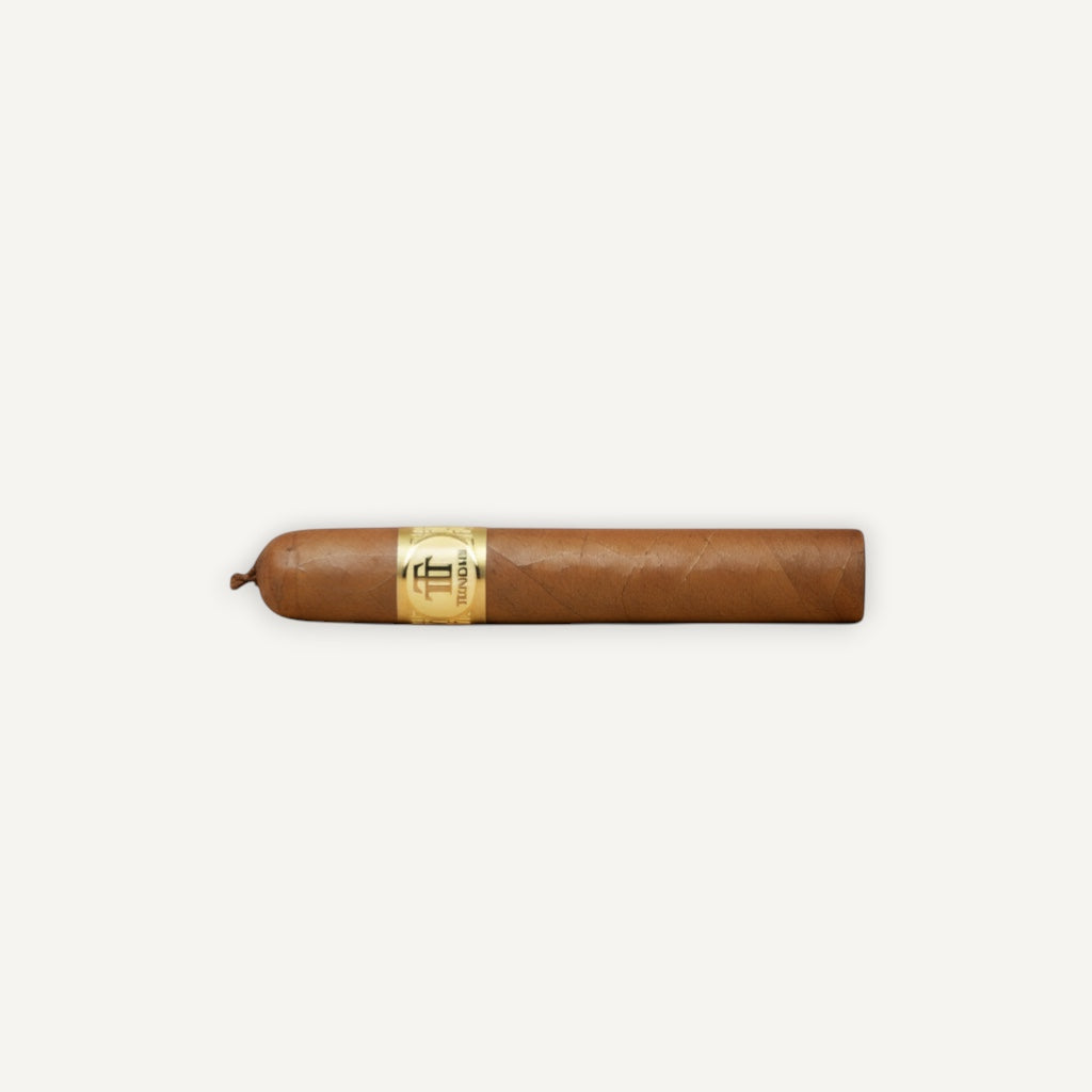 Arcadia Cigars Trinidad Reyes Petit Corona cigar with a golden band, medium strength, creamy, woody, and spicy notes.