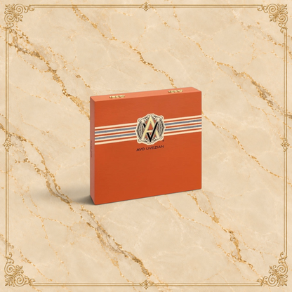 Arcadia Cigars AVO XO Preludio cigar box in orange with classic branding on a textured beige background