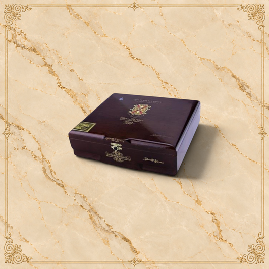 Arcadia Cigars Arturo Fuente Opus X Double Corona wooden cigar box with gold branding on a light beige background.