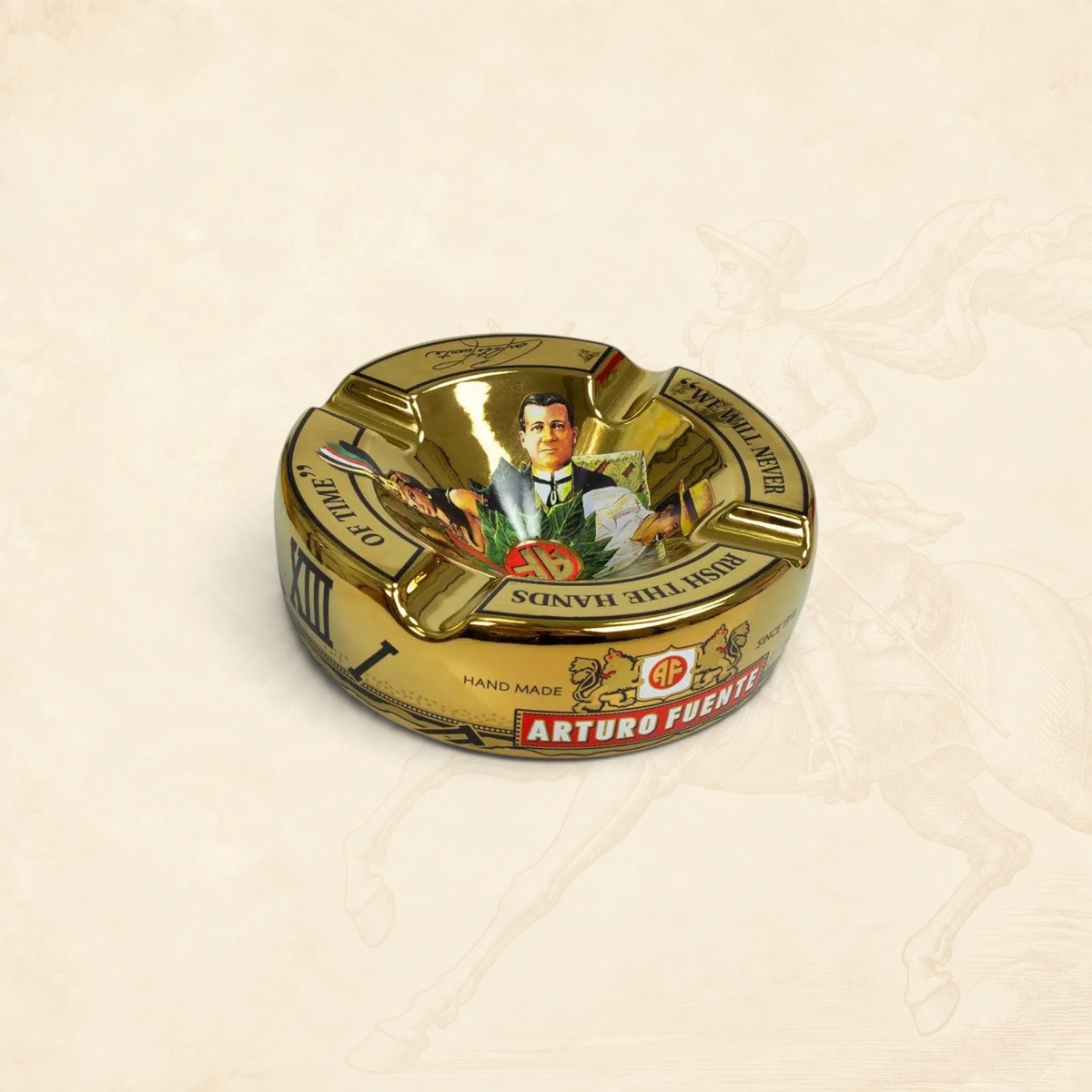Arcadia Cigars Arturo Fuente Hands of Time gold ceramic cigar ashtray with vintage portrait and branding details.