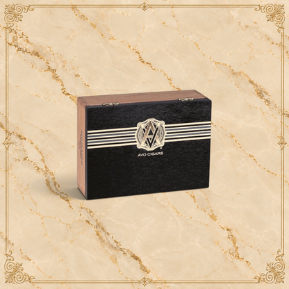 Arcadia Cigars AVO Classic Maduro Robusto cigar box featuring a black finish with white stripes and gold logo
