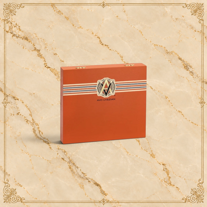 Arcadia Cigars AVO XO Maestoso wooden cigar box in orange with signature Avo Uvezian branding and striped detail