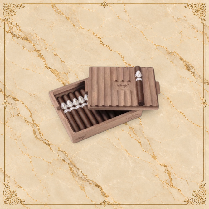 Arcadia Cigars Davidoff Chef's Edition 2025 Toro cigars in a wooden box with a ribbed lid on a textured background.