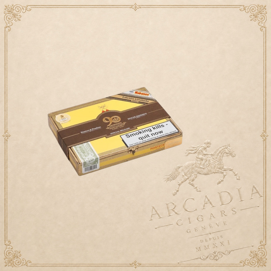 Arcadia Cigars Montecristo 520 Edición Limitada 2012 cigar box with yellow and brown branding on a beige background.