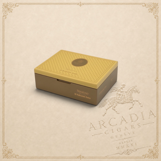 Arcadia Cigars Trinidad Robusto Extra cigar box with a gold patterned lid and brown base on a neutral background.