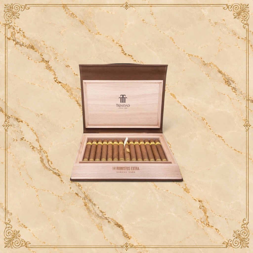 Arcadia Cigars Trinidad Robustos Extra cigars in a wooden travel humidor with gold branding on a beige background