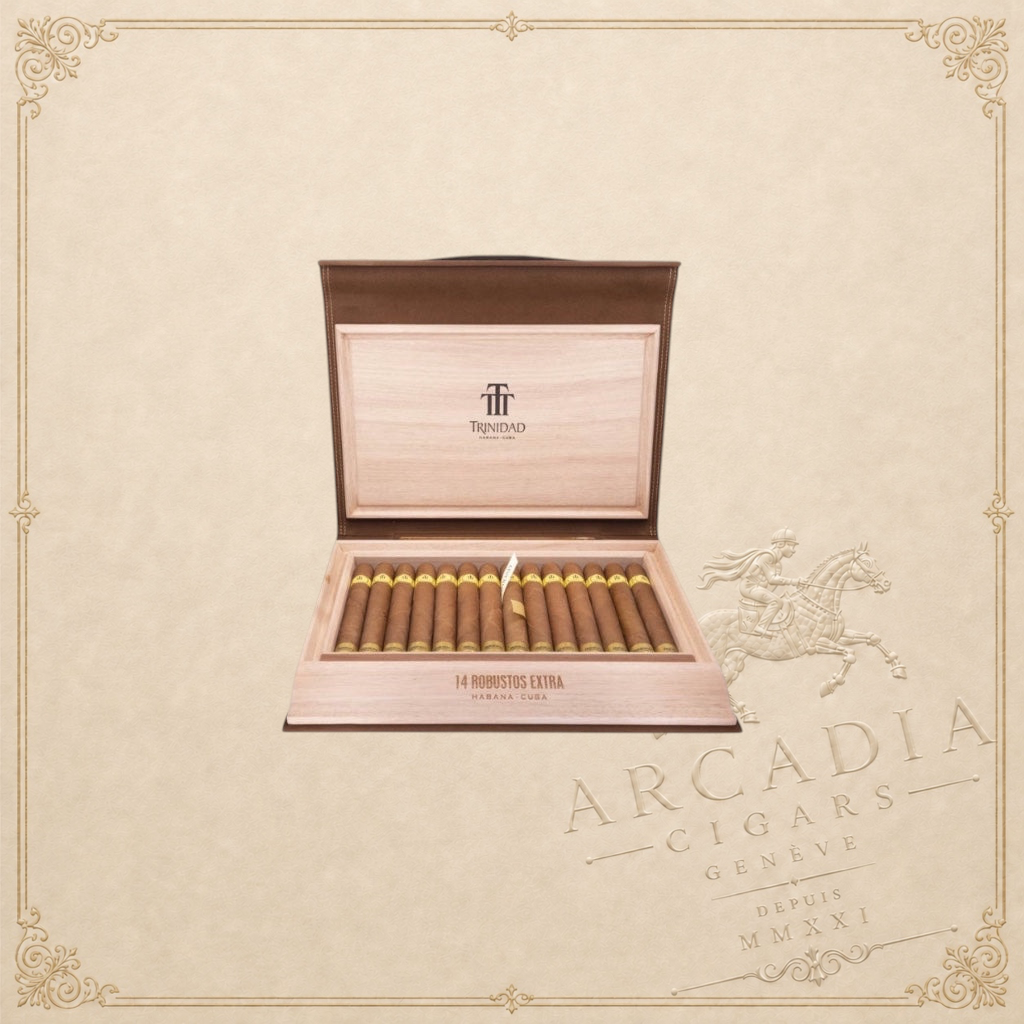 Arcadia Cigars Trinidad Robustos Extra cigars in a wooden travel humidor with gold branding on a beige background