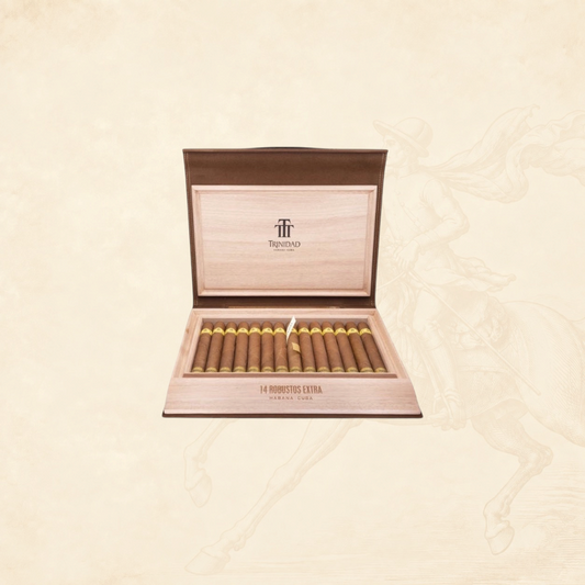 Arcadia Cigars Trinidad Robustos Extra cigars in a wooden travel humidor with gold branding on a beige background