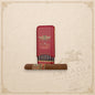 Arcadia Cigars Arturo Fuente Angel's Share Reserva Du Château cigar with its signature red metal case on a map background