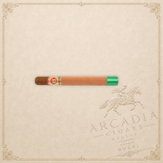 Arcadia Cigars Arturo Fuente Double Chateau cigar with a cedar sleeve and green ribbon on a cream background