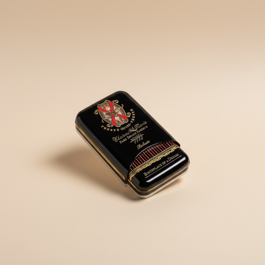 Arcadia Cigars Arturo Fuente Opus X Robusto cigar tin, black with gold lettering and red accents.