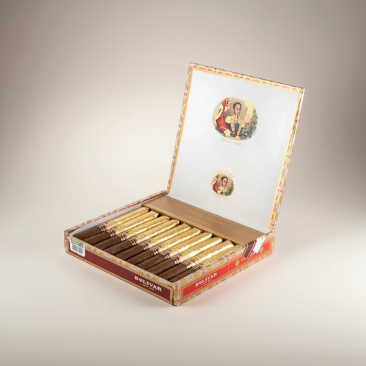 Arcadia Cigars presents the Bolívar New Gold Medal, an exclusive LCDH cigar box featuring 10 Cervantes format cigars with dark brown wrappers and gold bands.