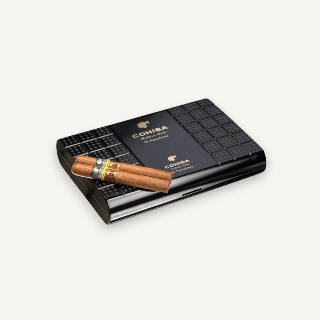Arcadia Cigars Cohiba Novedosos LCDH cigar box with two Coronas Extra cigars. Black textured box with gold branding.