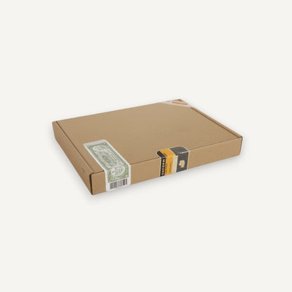 Arcadia Cigars Cohiba Piramides Extra box, featuring a cardboard exterior with green and gold band details.
