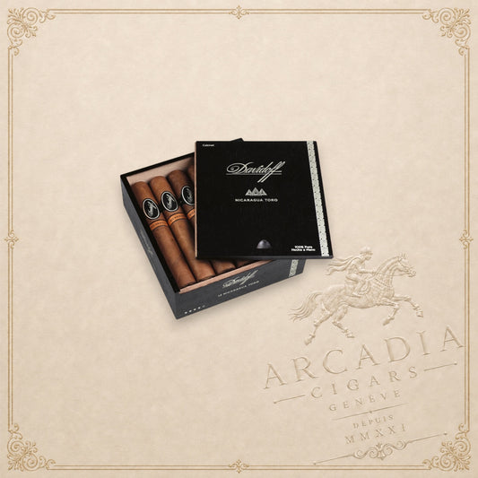 Arcadia Cigars Davidoff Nicaragua Toro Vintage 2023 premium cigars in an open black wooden presentation box