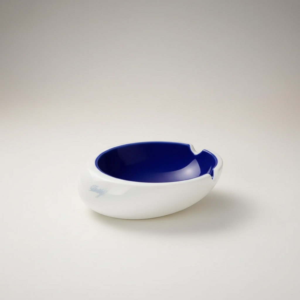 Arcadia Cigars Davidoff Royal Release blue porcelain ashtray with gold insignia and four rests.