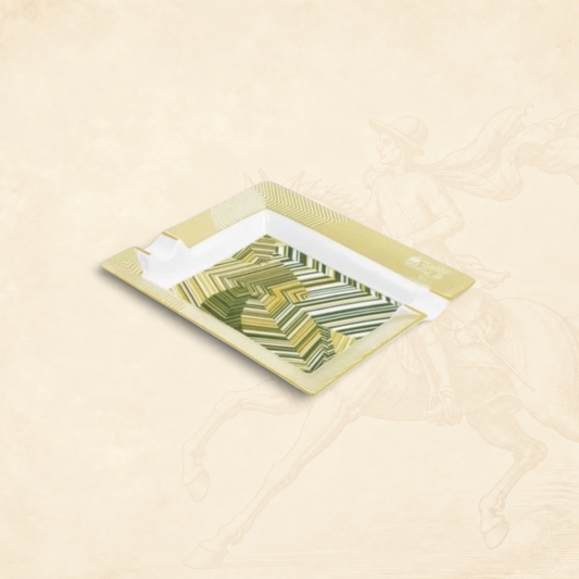 Arcadia Cigars Davidoff Cave de Paille ashtray, golden-beige straw marquetry with green abstract pattern on lacquered base.