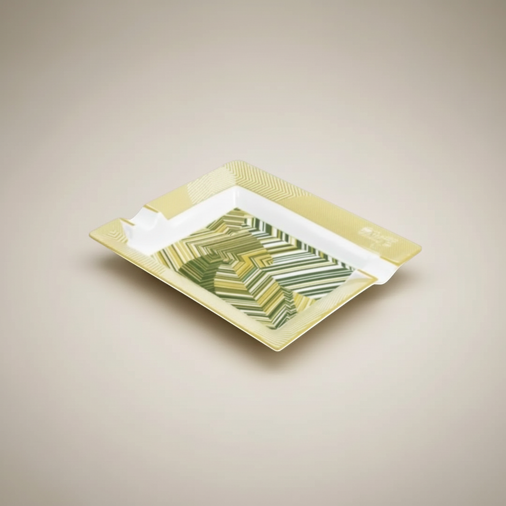 Arcadia Cigars Davidoff Cave de Paille ashtray, golden-beige straw marquetry with green abstract pattern on lacquered base.