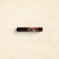 Arcadia Cigars God of Fire Serie B Robusto cigar in a protective black tubo with ornate decorative branding