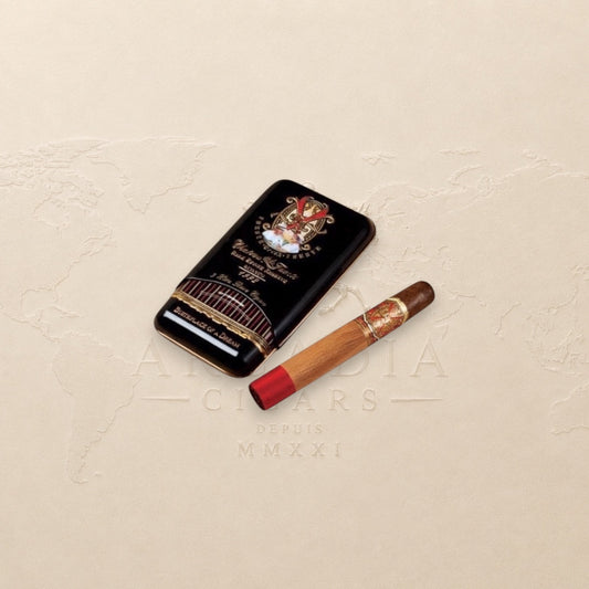 Arcadia Cigars Arturo Fuente Opus X Perfecxion X cigar with red band and gold accents, next to its black tin.