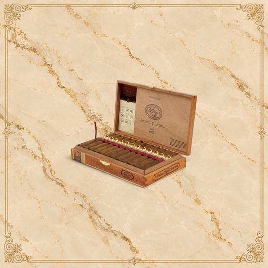 Arcadia Cigars Padron 1926 No.6 premium hand-rolled Nicaraguan cigars in an open wooden box with gold ribbon