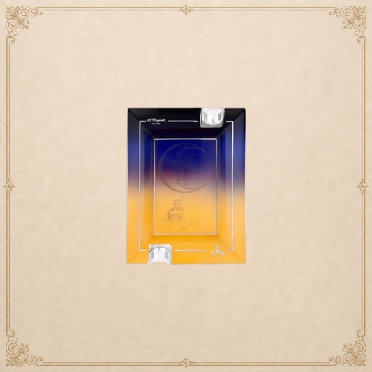 Arcadia Cigars S.T. Dupont Montecristo L' Aurore porcelain ashtray with sunrise motif, pink and gold tones, two rests.