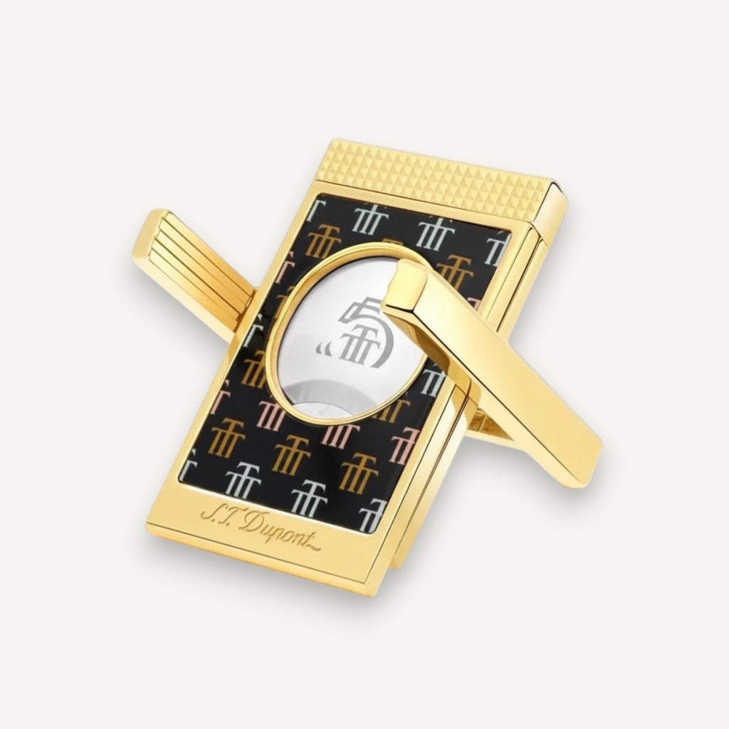 Arcadia Cigars S.T. Dupont Trinidad cigar cutter with gold finish and black lacquer body featuring the Trinidad "Golden T" motif.