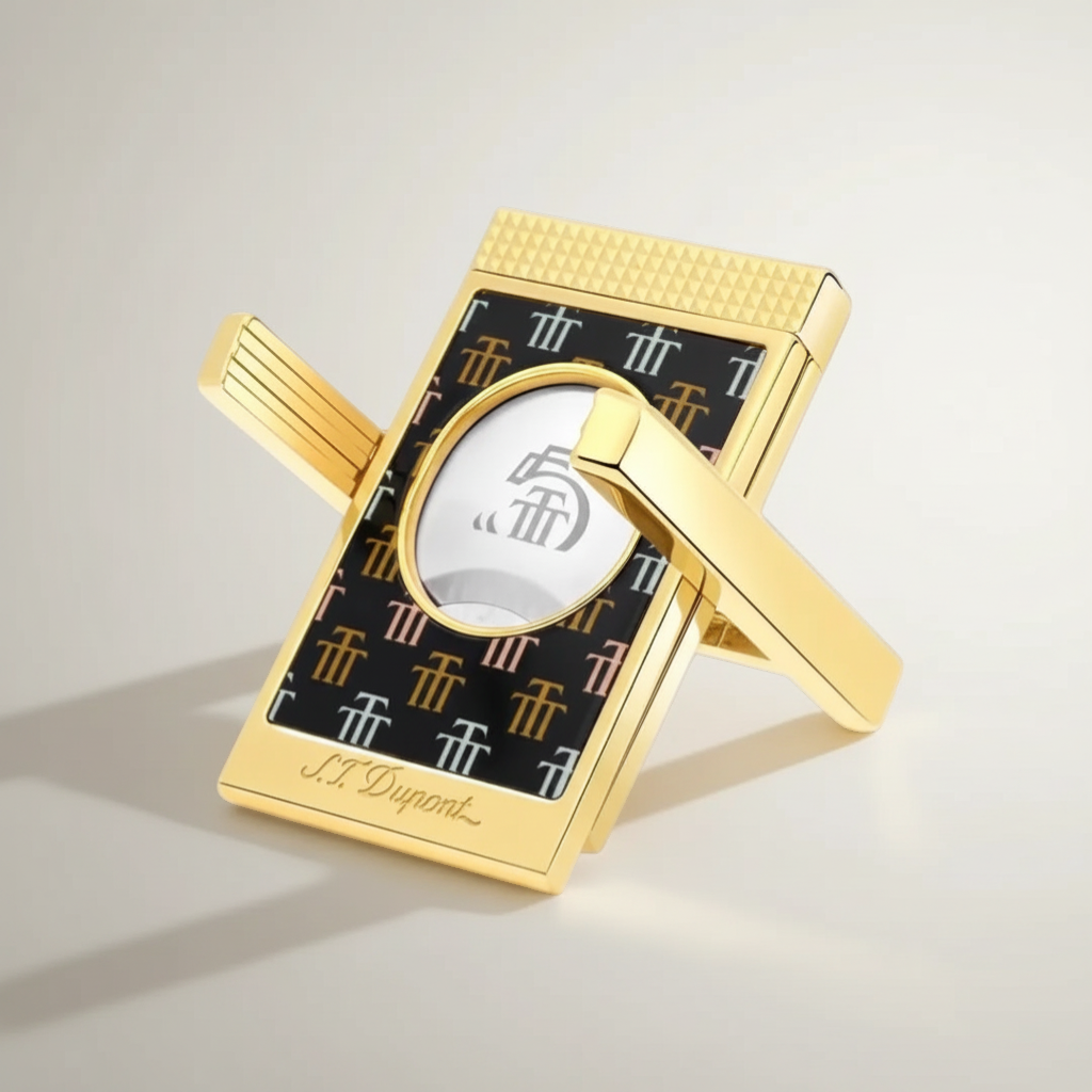 Arcadia Cigars S.T. Dupont Trinidad cigar cutter with gold finish and black lacquer body featuring the Trinidad "Golden T" motif.