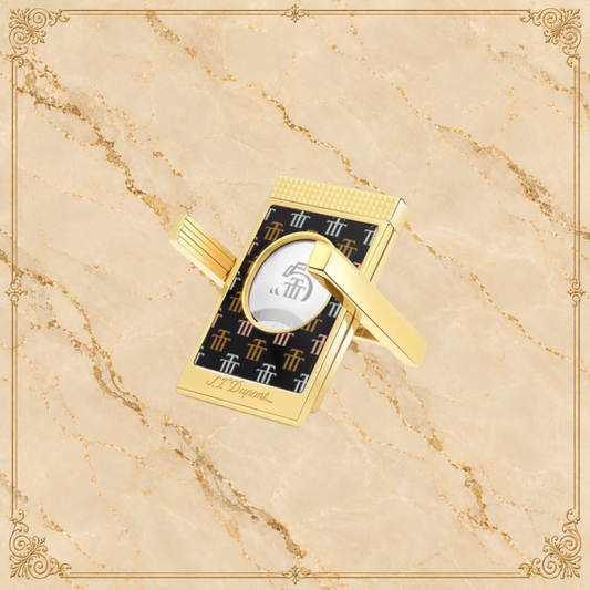 Arcadia Cigars S.T. Dupont Trinidad cigar cutter with gold finish and black lacquer body featuring the Trinidad "Golden T" motif.