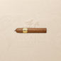 Arcadia Cigars Trinidad Reyes Petit Corona cigar with a golden band, medium strength, creamy, woody, and spicy notes.