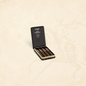 Arcadia Cigars Winston Churchill Late Hour Belicoso cigars in a black metal tin with gold branding